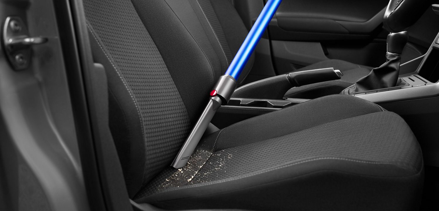 Car cleaning with a Dyson vacuum using the crevice tool 